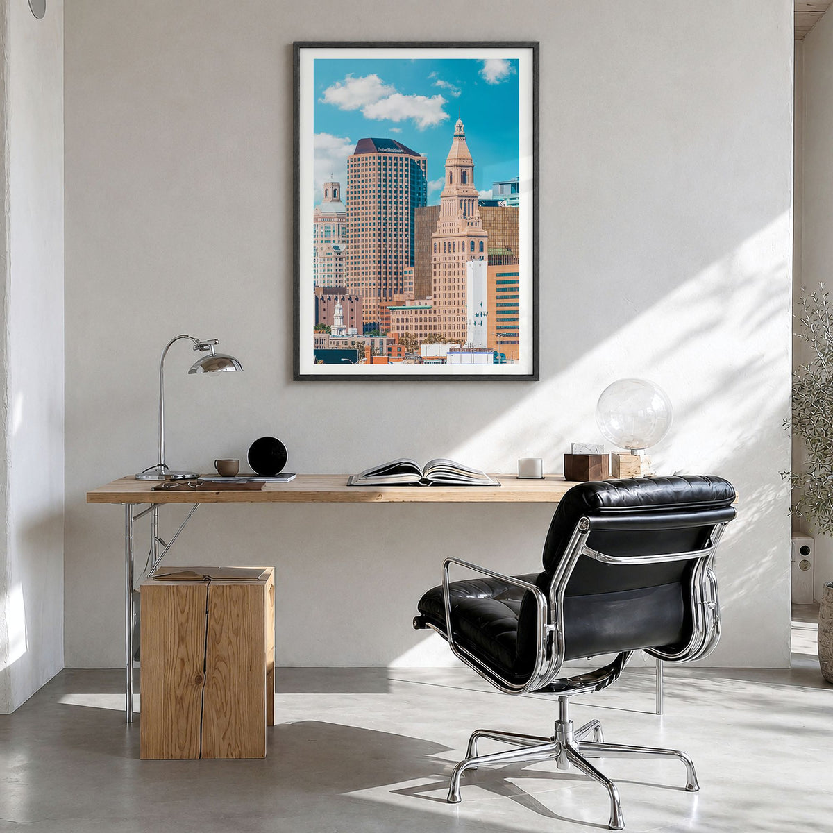 Hartford Photo Poster in a black wood frame, hanging in a bright home office, white border