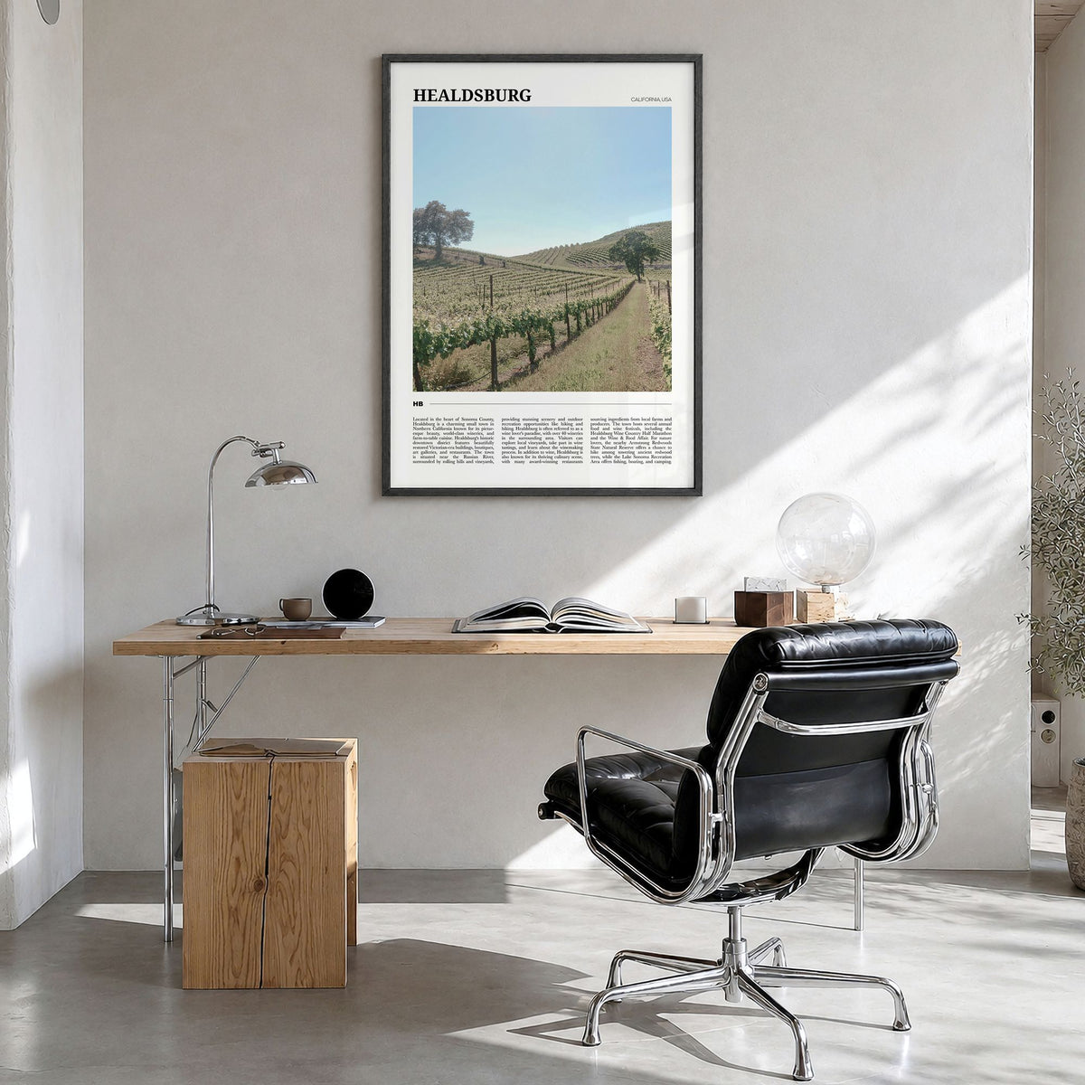 Healdsburg Travel Poster in a black wood frame, hanging in a bright home office