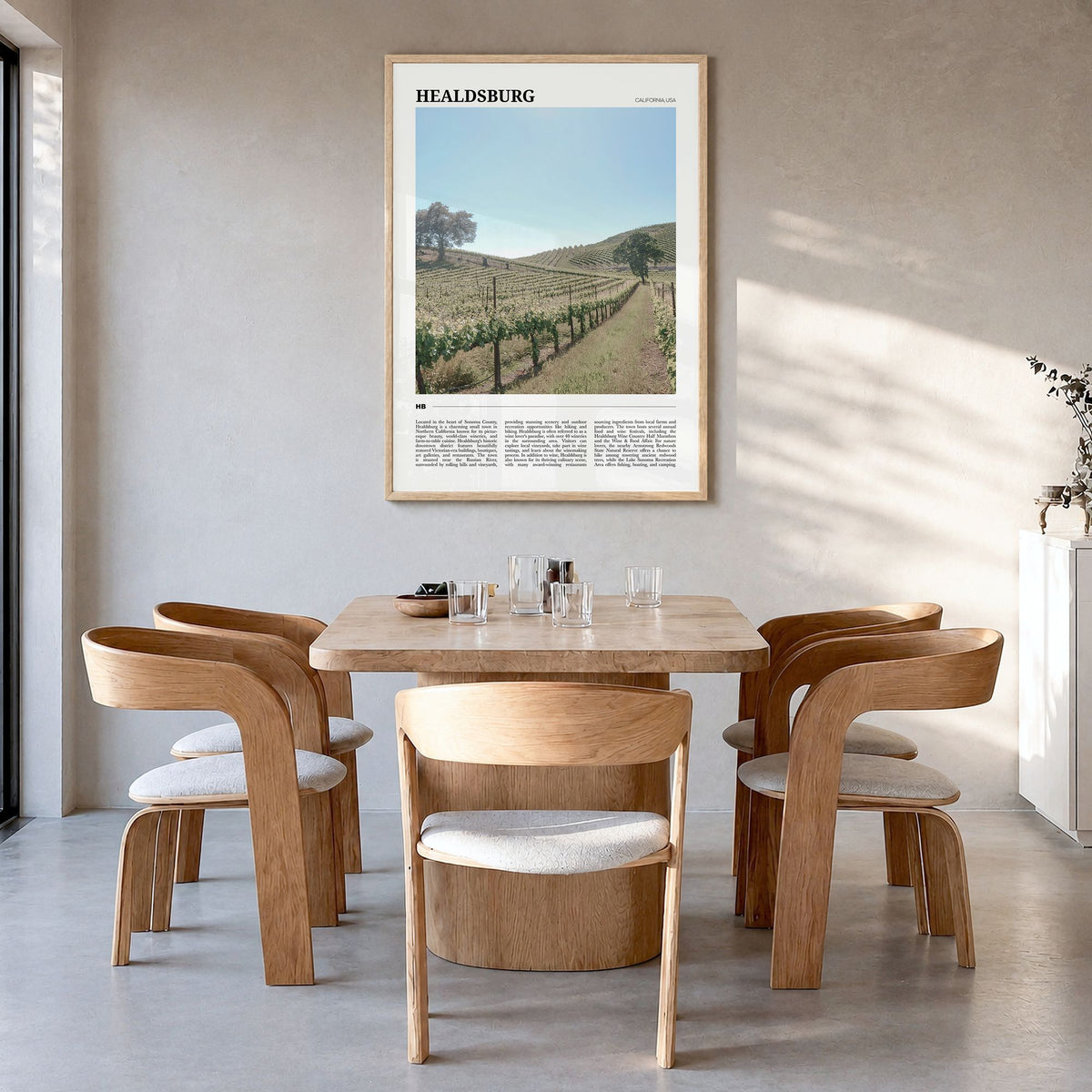 Healdsburg Travel Poster in a natural wood frame, hanging in a dining room