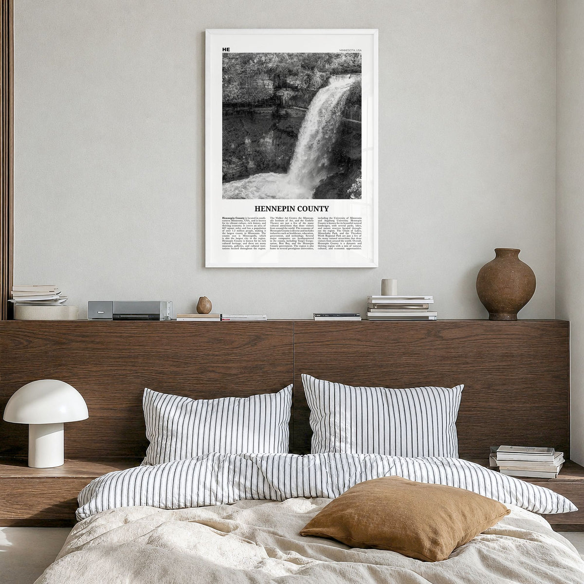 Hennepin County Newspaper Poster in a white wood frame, hanging in a bedroom