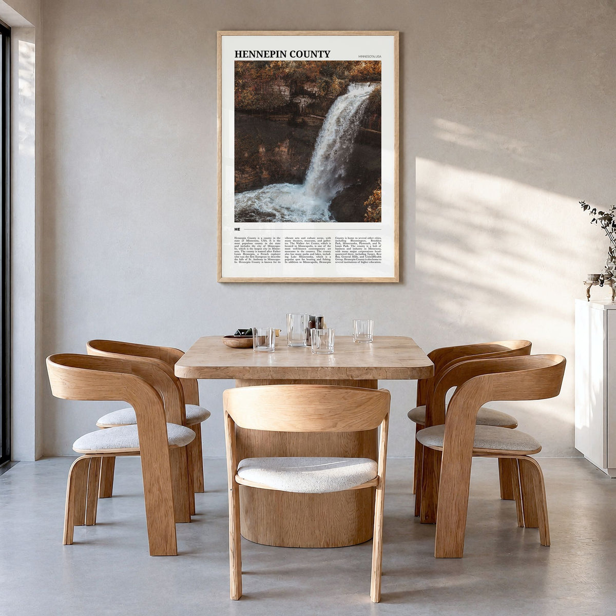 Hennepin County Travel Poster in a natural wood frame, hanging in a dining room