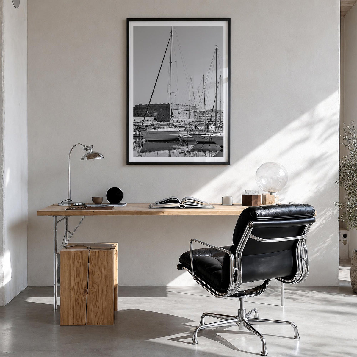 Heraklion black & white photo poster of Greece – vertical wall art in black wood frame with white border, hanging on wall