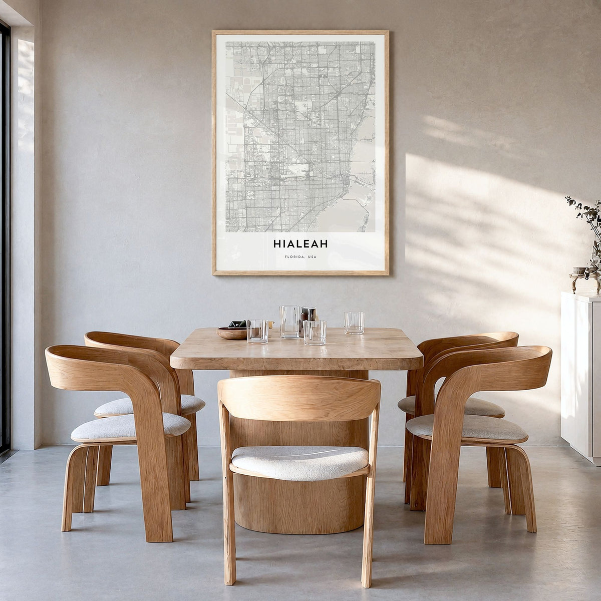 Hialeah Map Poster in a natural wood frame, hanging in a dining room