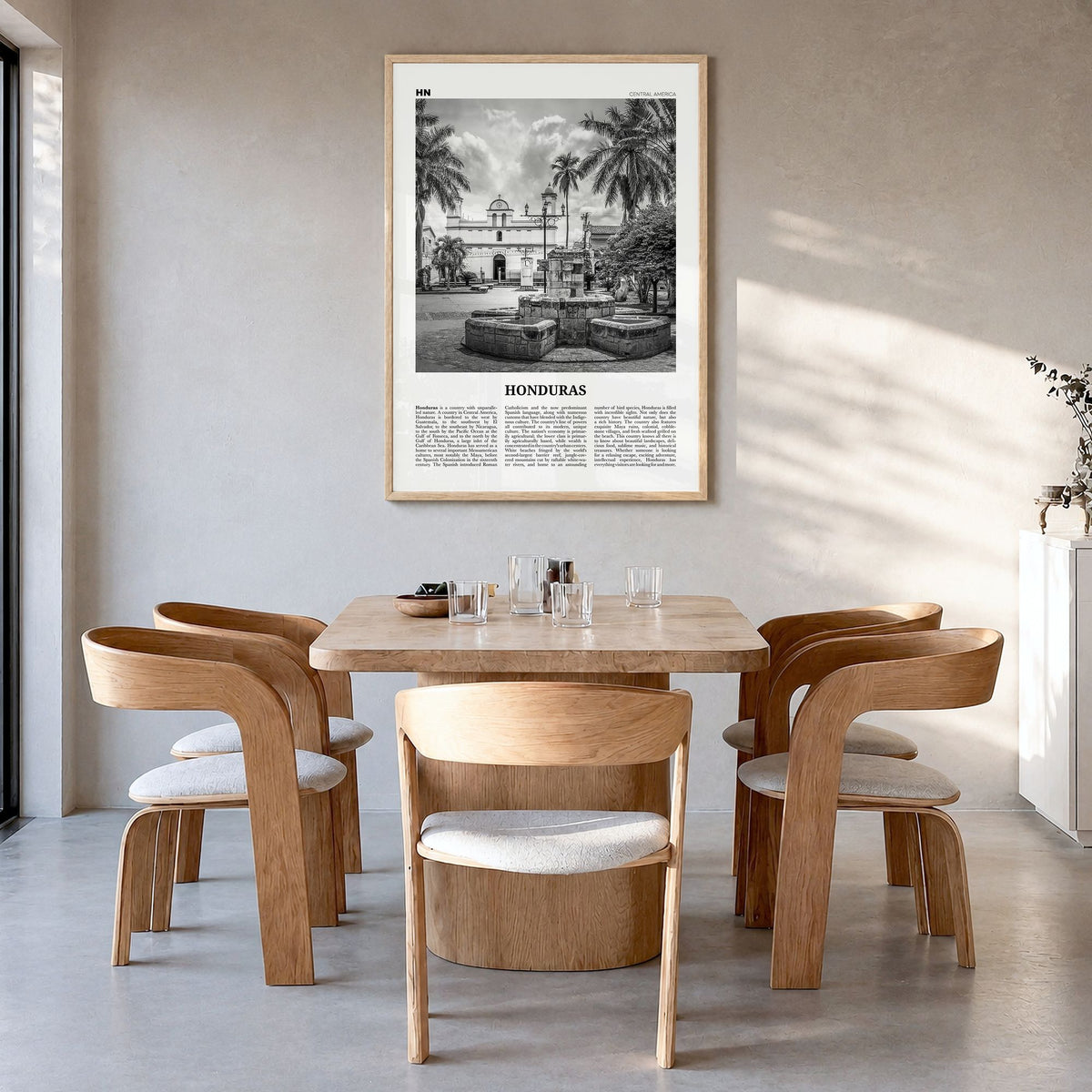 Honduras Newspaper No 2 Poster in a natural wood frame, hanging in a dining room