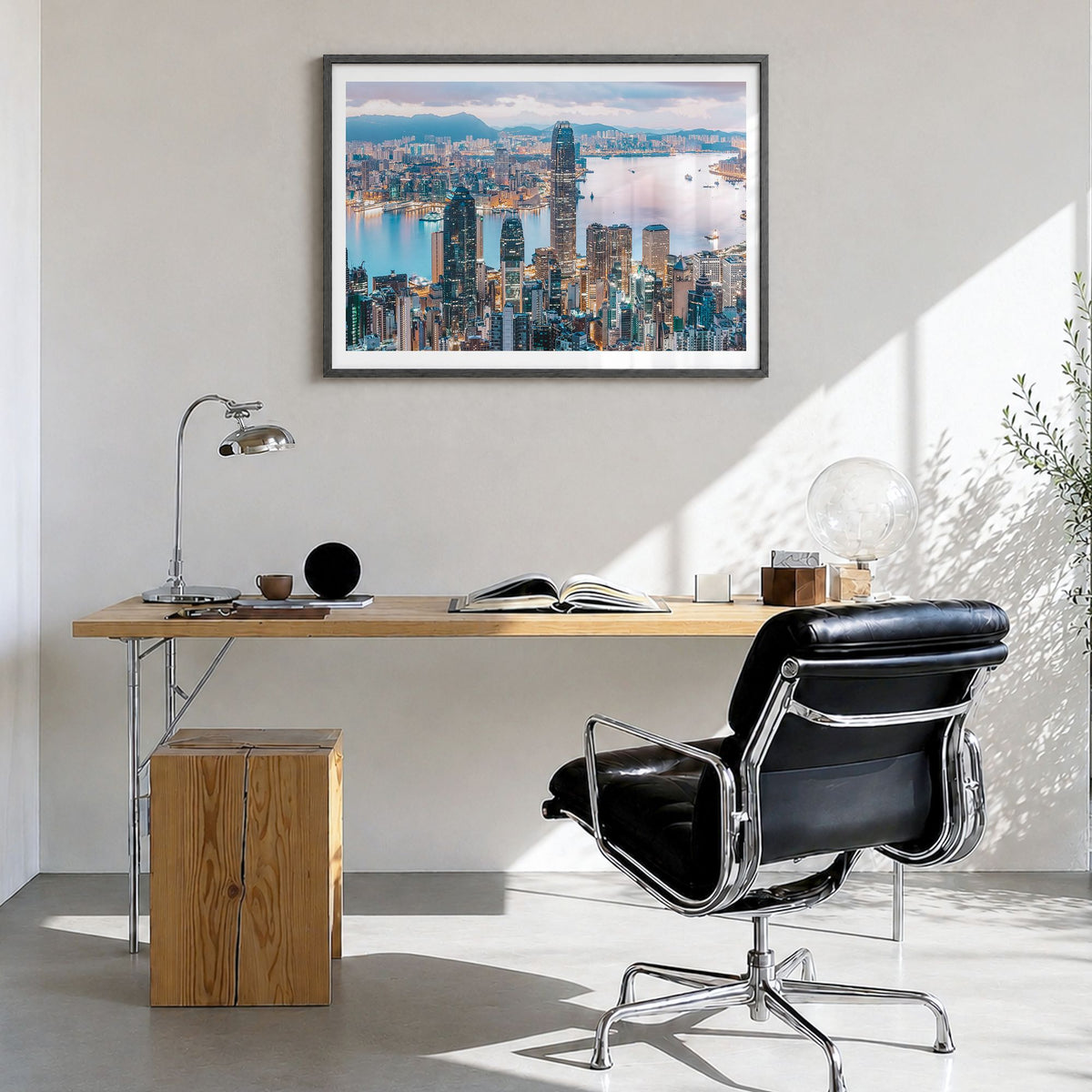 Hong Kong Photo Poster in a black wood frame, hanging in a bright home office, white border