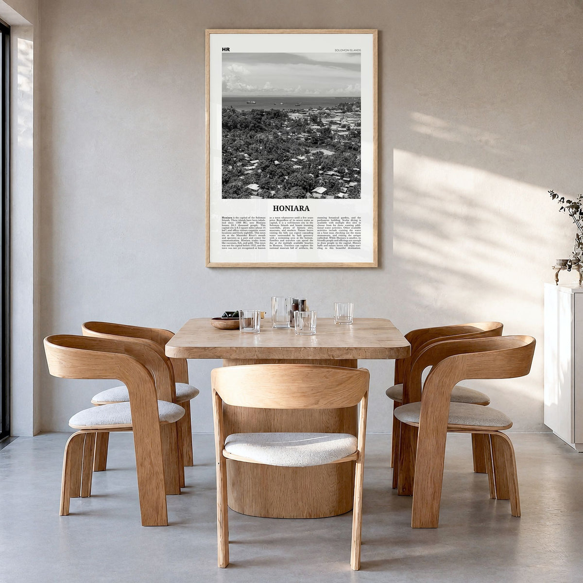 Honiara Newspaper Poster in a natural wood frame, hanging in a dining room