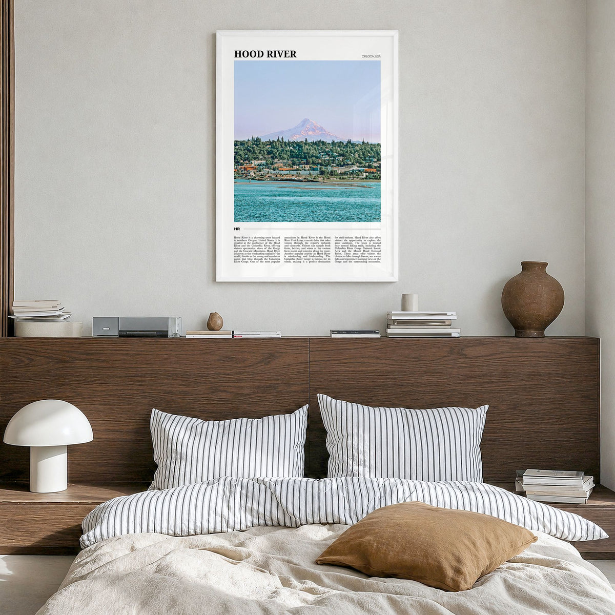 Hood River Travel Poster in a white wood frame, hanging in a bedroom