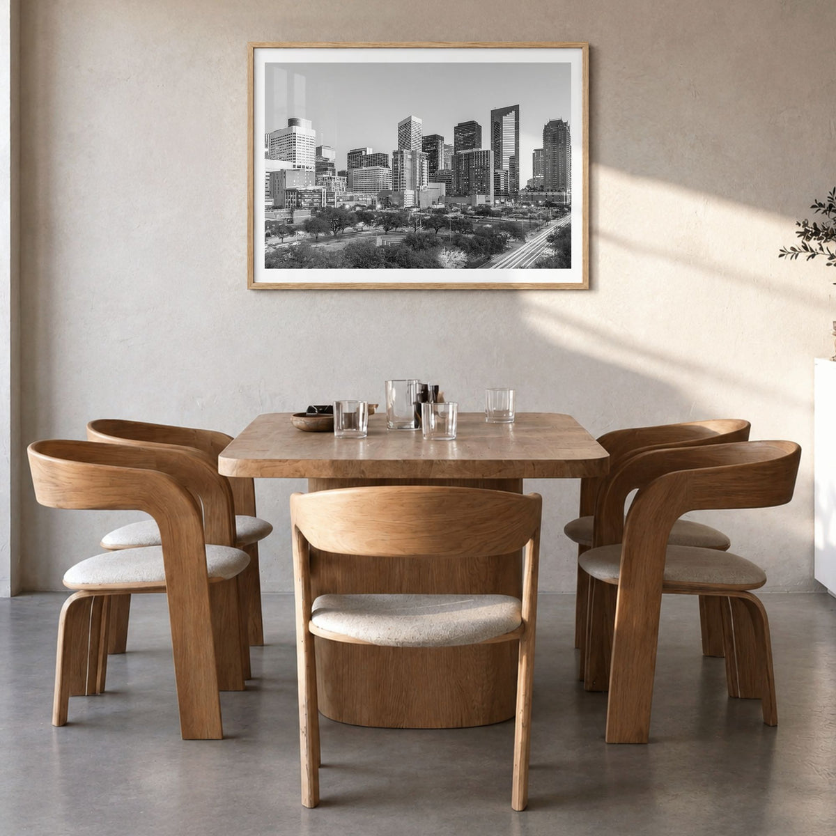 Houston Photo Poster in a natural wood frame, hanging in a dining room, white border