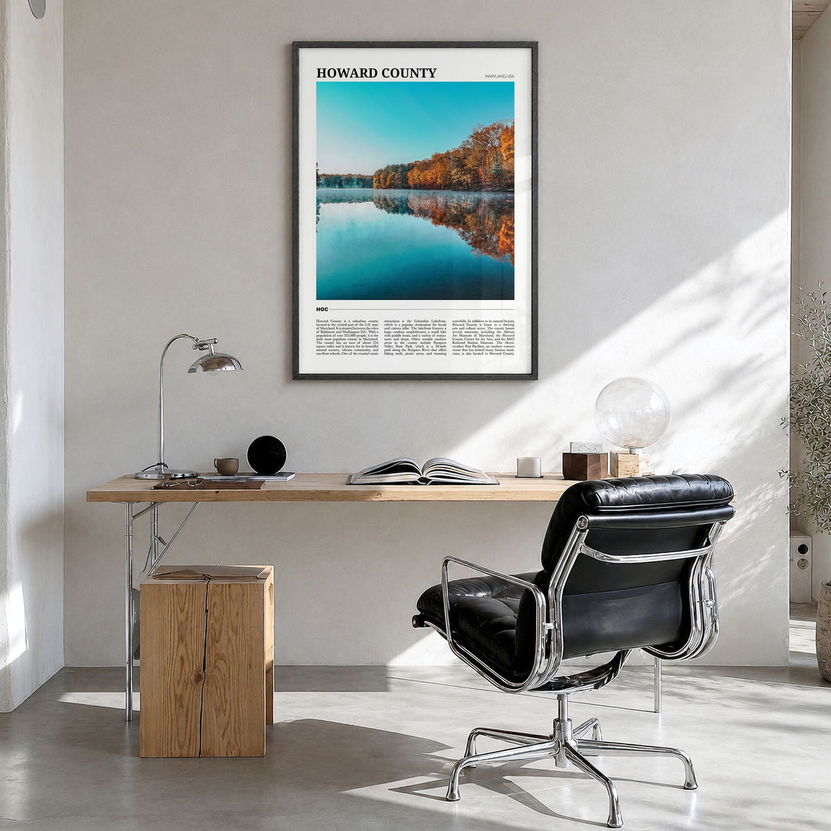 Howard County Travel Poster in a black wood frame, hanging in a bright home office