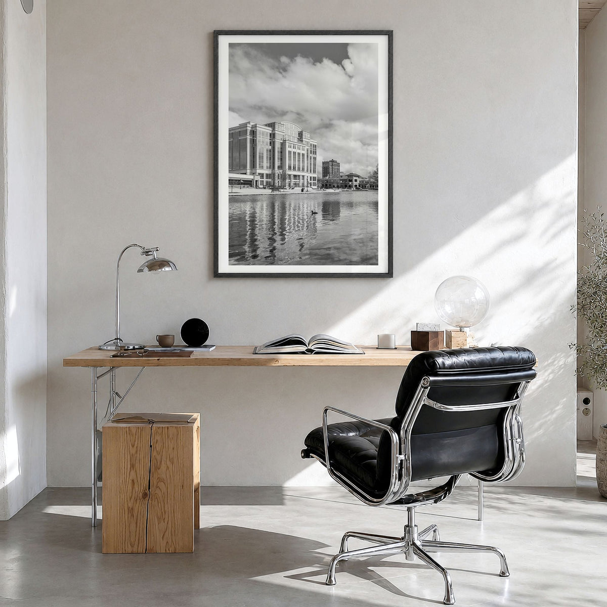 Huntsville Photo Poster in a black wood frame, hanging in a bright home office, white border