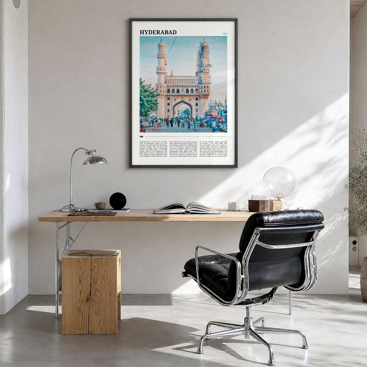 Hyderabad Travel Poster in a black wood frame, hanging in a bright home office
