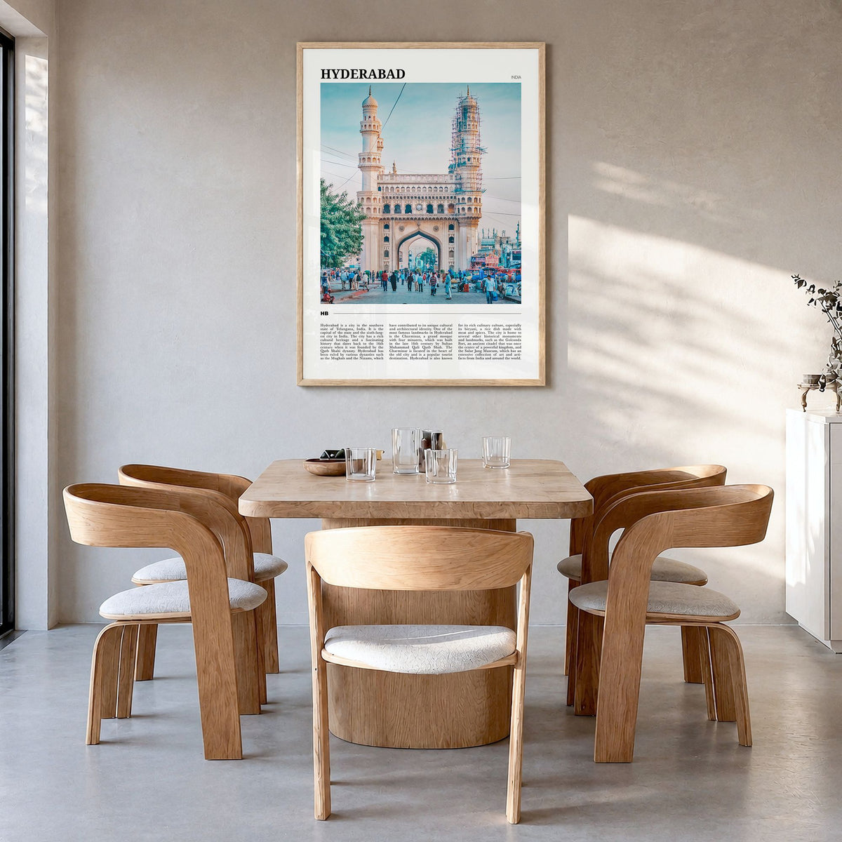 Hyderabad Travel Poster in a natural wood frame, hanging in a dining room
