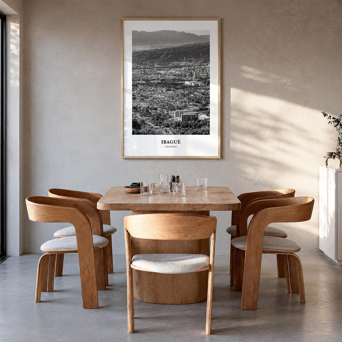 Ibagué black & white classic poster of Colombia – vertical wall art in natural wood frame, hanging on wall
