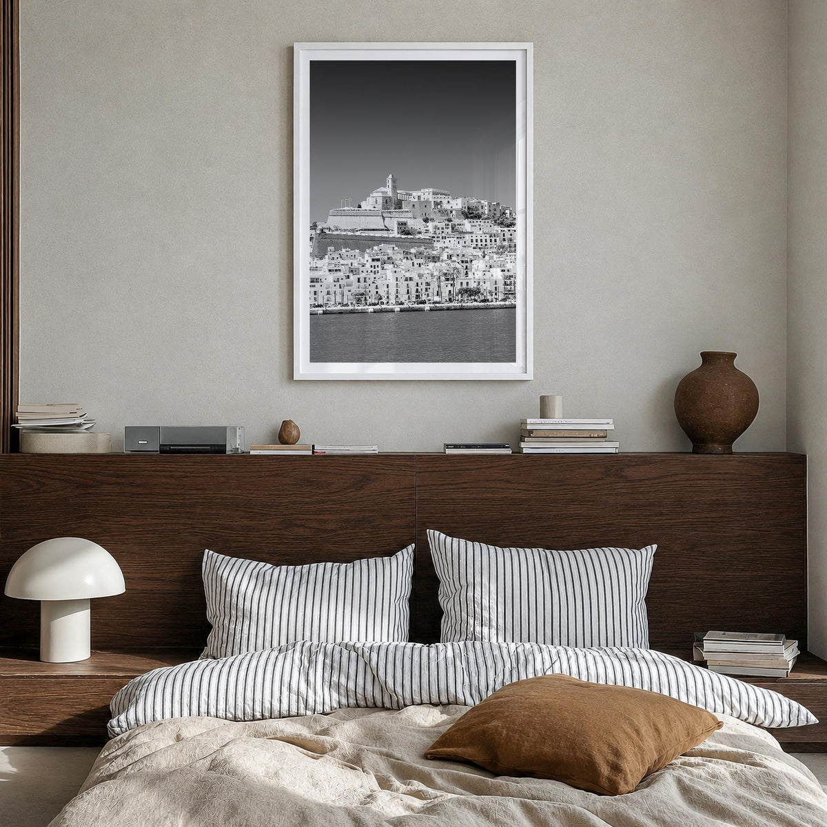 Ibiza black & white photo poster of Spain – vertical wall art in white wood frame with white border, hanging on wall
