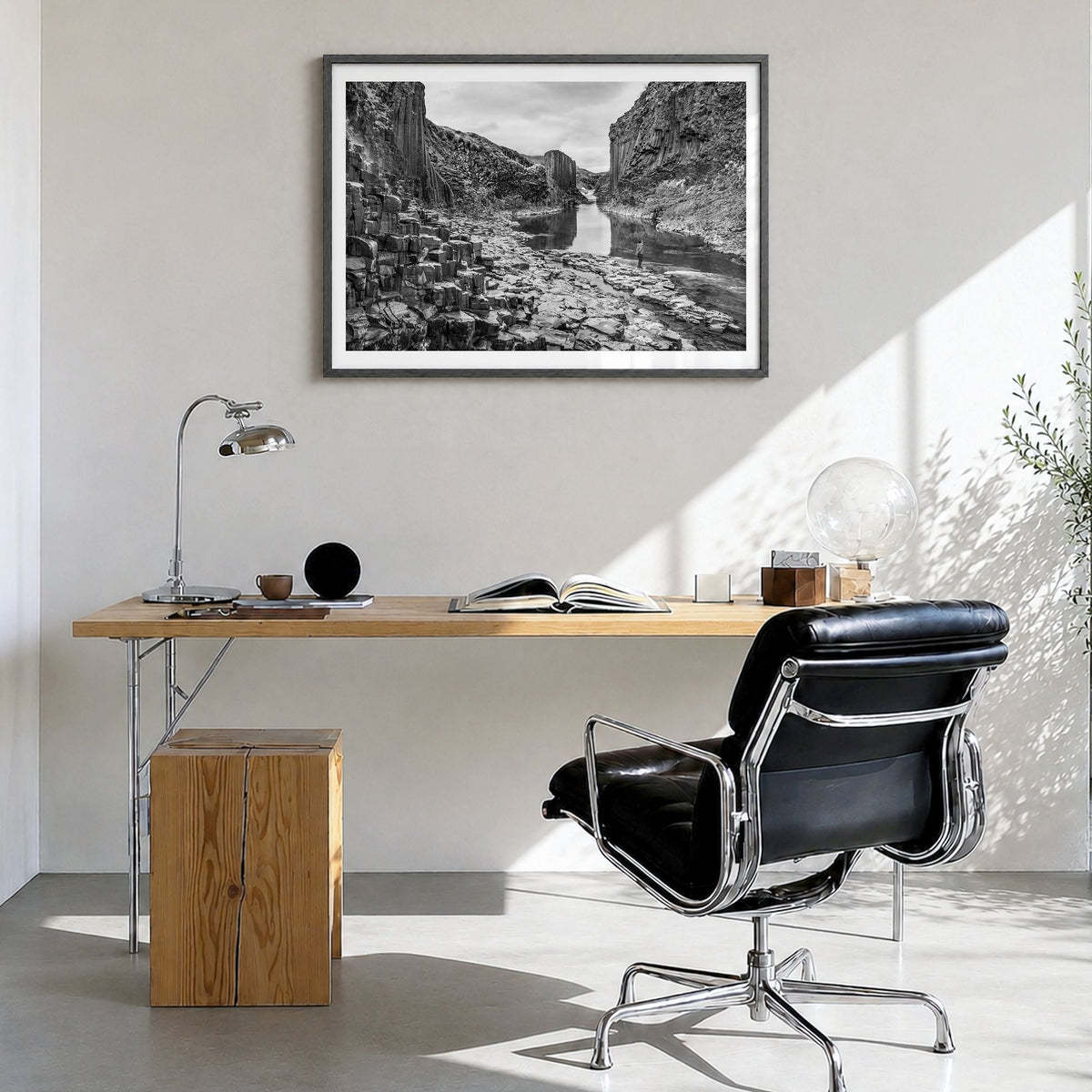 Iceland Photo Poster in a black wood frame, hanging in a bright home office, white border