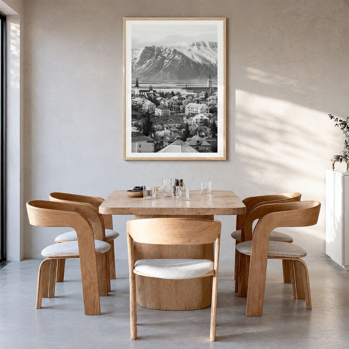 Iceland Photo Poster in a natural wood frame, hanging in a dining room, white border