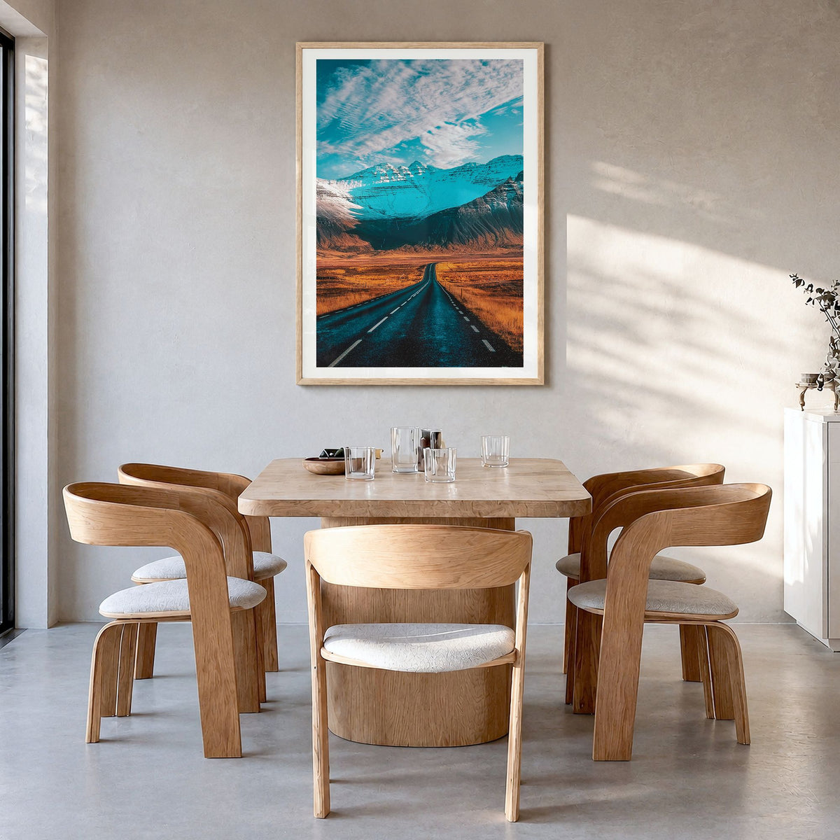 Iceland Photo Poster in a natural wood frame, hanging in a dining room, white border