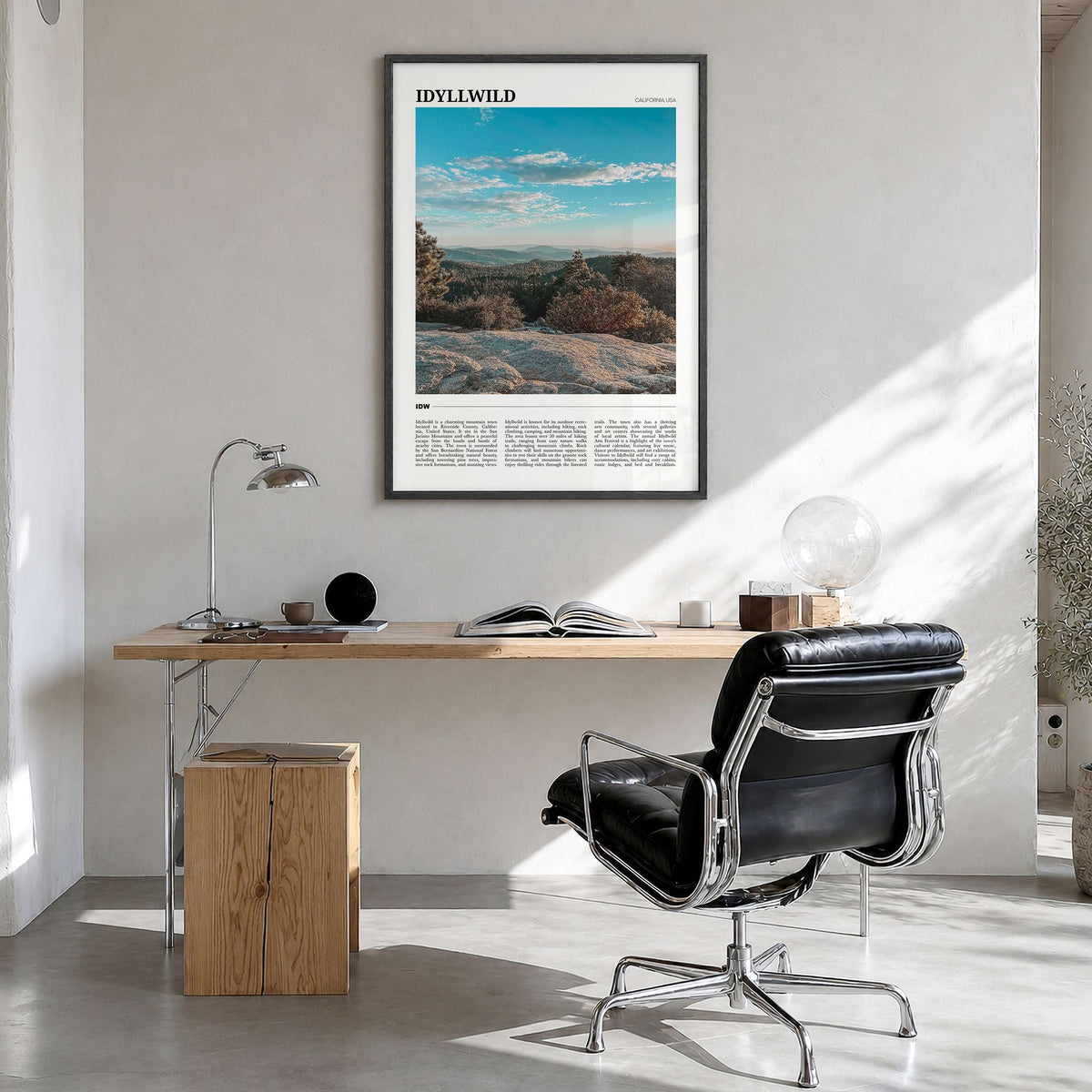 Idyllwild Travel Poster in a black wood frame, hanging in a bright home office