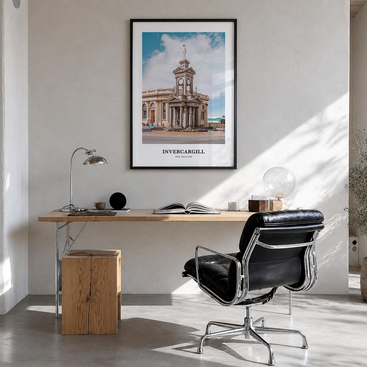 Invercargill colorful classic poster of New Zealand – vertical wall art in black wood frame, hanging on wall