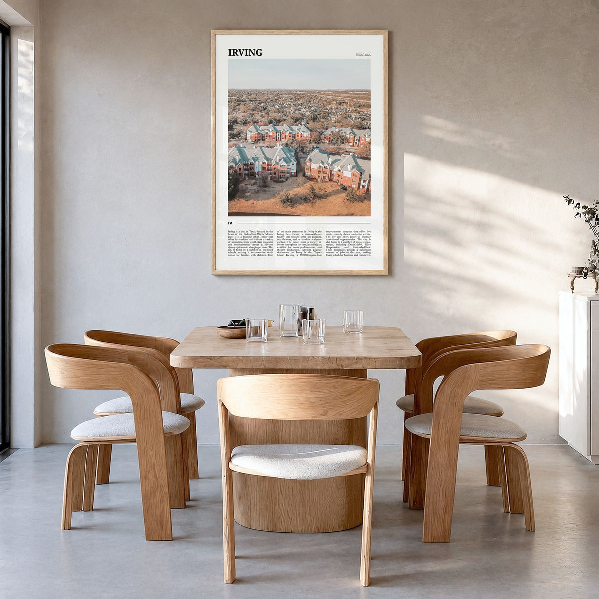 Irving Travel Poster in a natural wood frame, hanging in a dining room