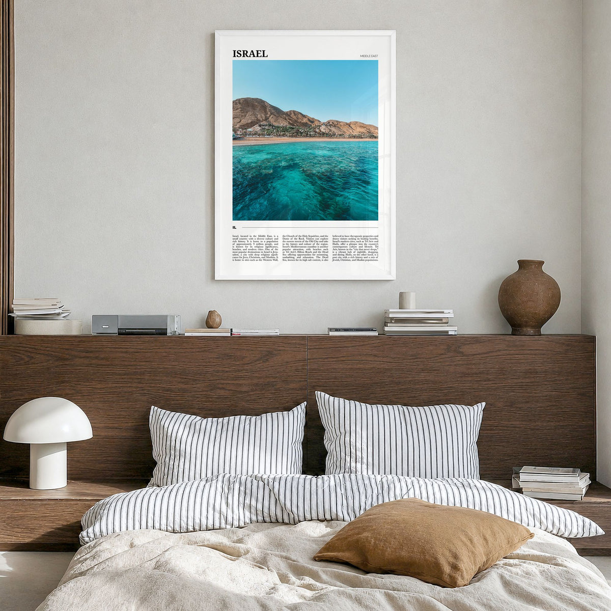 Israel Travel Poster in a white wood frame, hanging in a bedroom