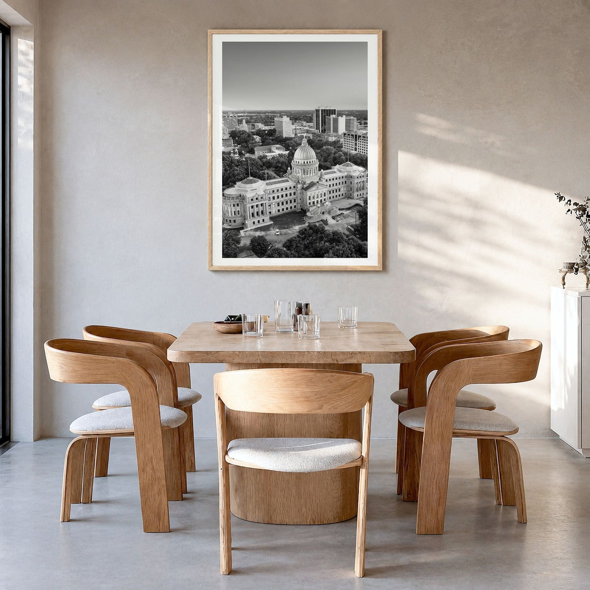 Jackson, Mississippi Photo Poster in a natural wood frame, hanging in a dining room, white border