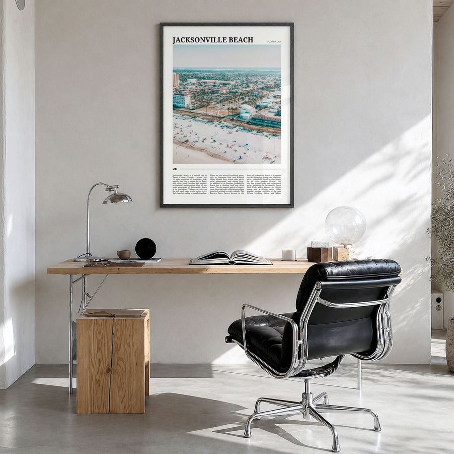 Jacksonville Beach Travel Poster in a black wood frame, hanging in a bright home office