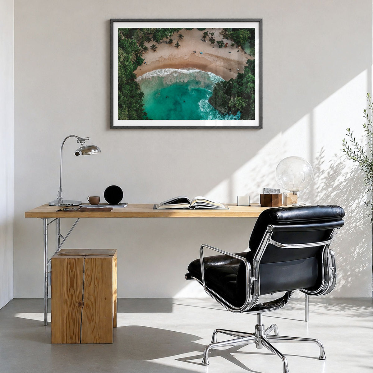 Jamaica Photo Poster in a black wood frame, hanging in a bright home office, white border