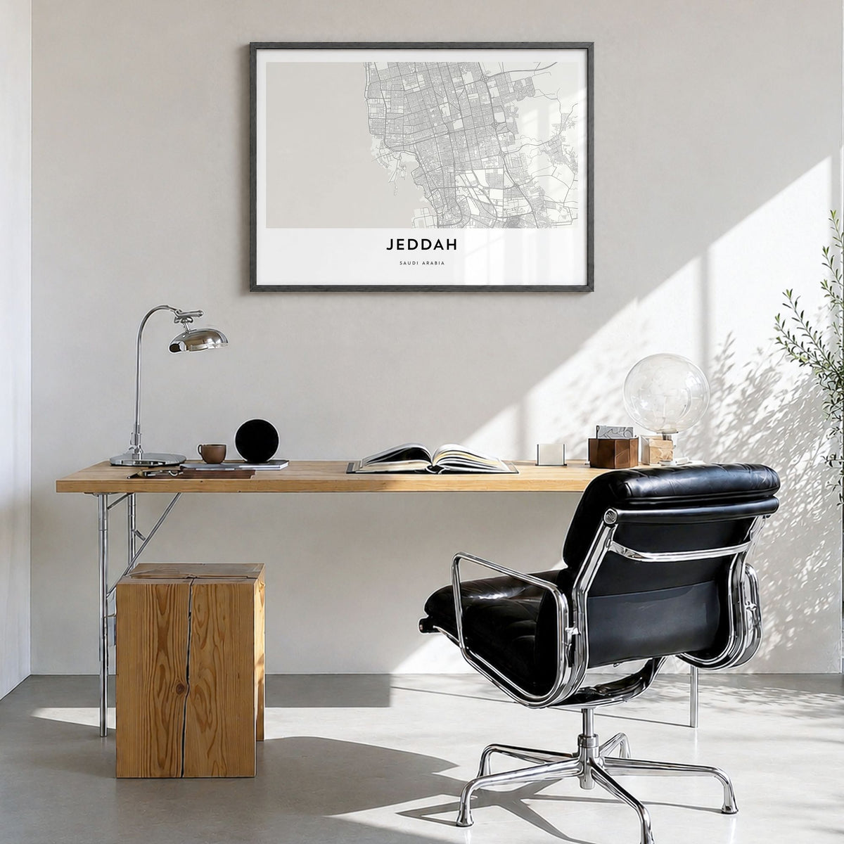 Jeddah Map Poster in a black wood frame, hanging in a bright home office