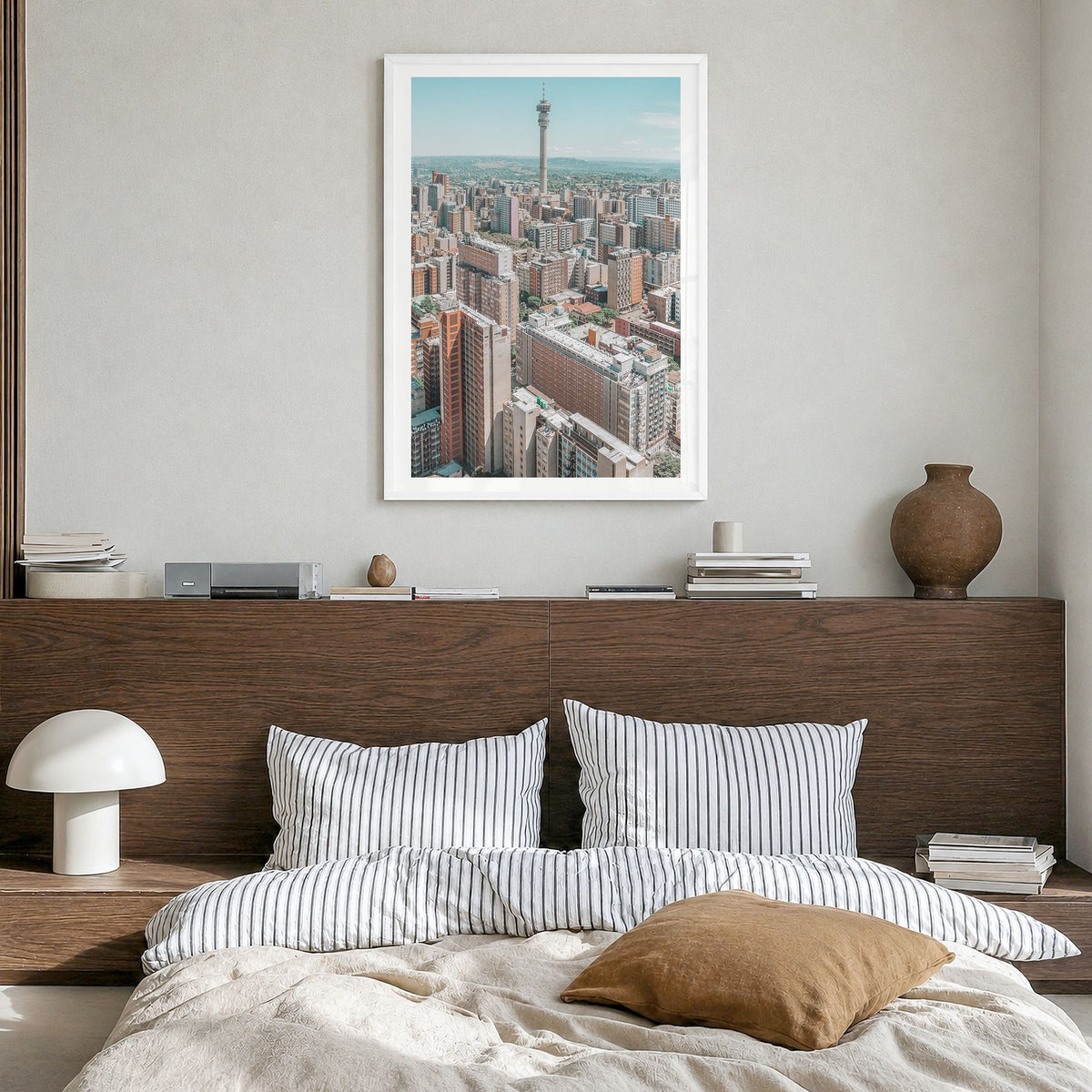 Johannesburg Photo Poster in a white wood frame, hanging in a bedroom, white border