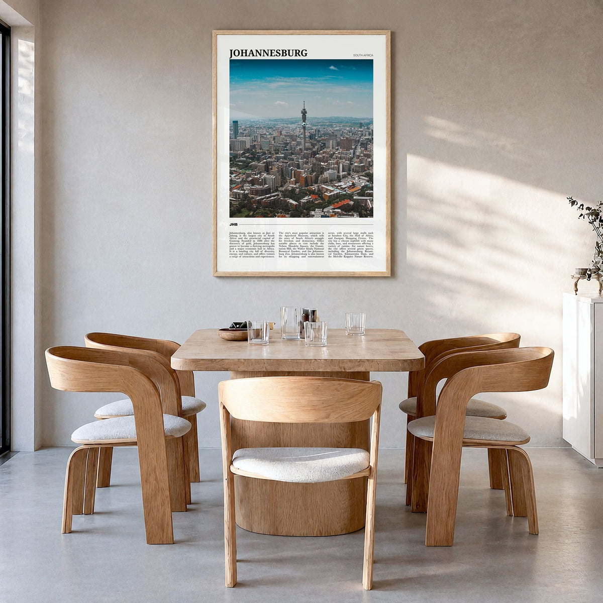Johannesburg Travel Poster in a natural wood frame, hanging in a dining room
