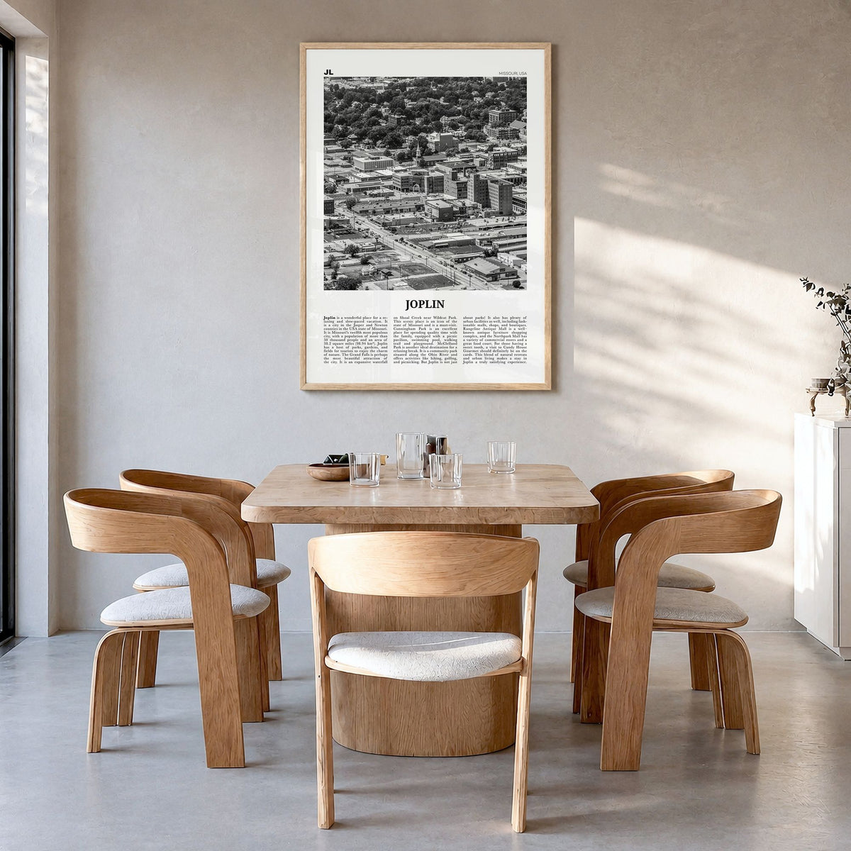 Joplin Newspaper Poster in a natural wood frame, hanging in a dining room