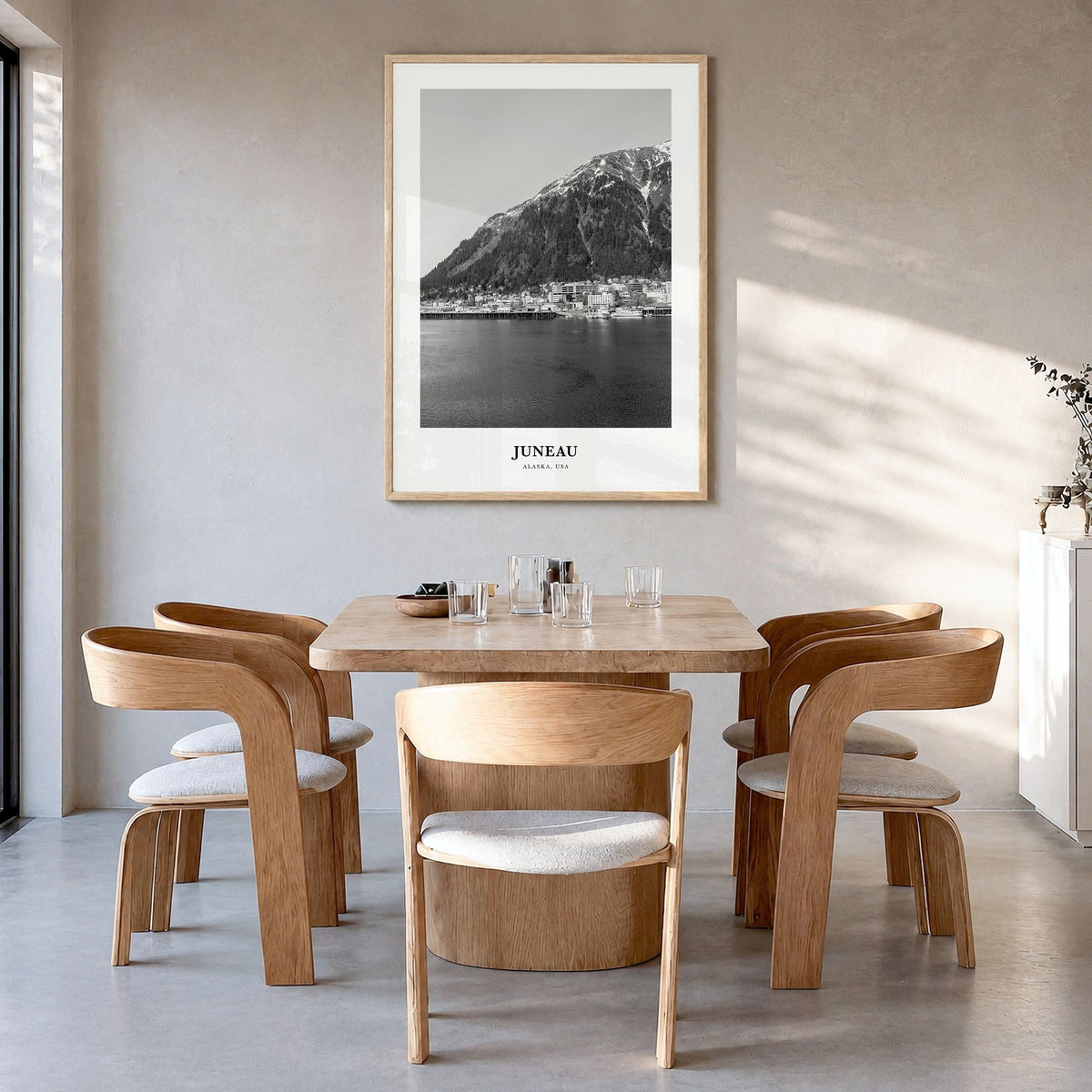 Juneau Classic No 2 Poster in a natural wood frame, hanging in a dining room