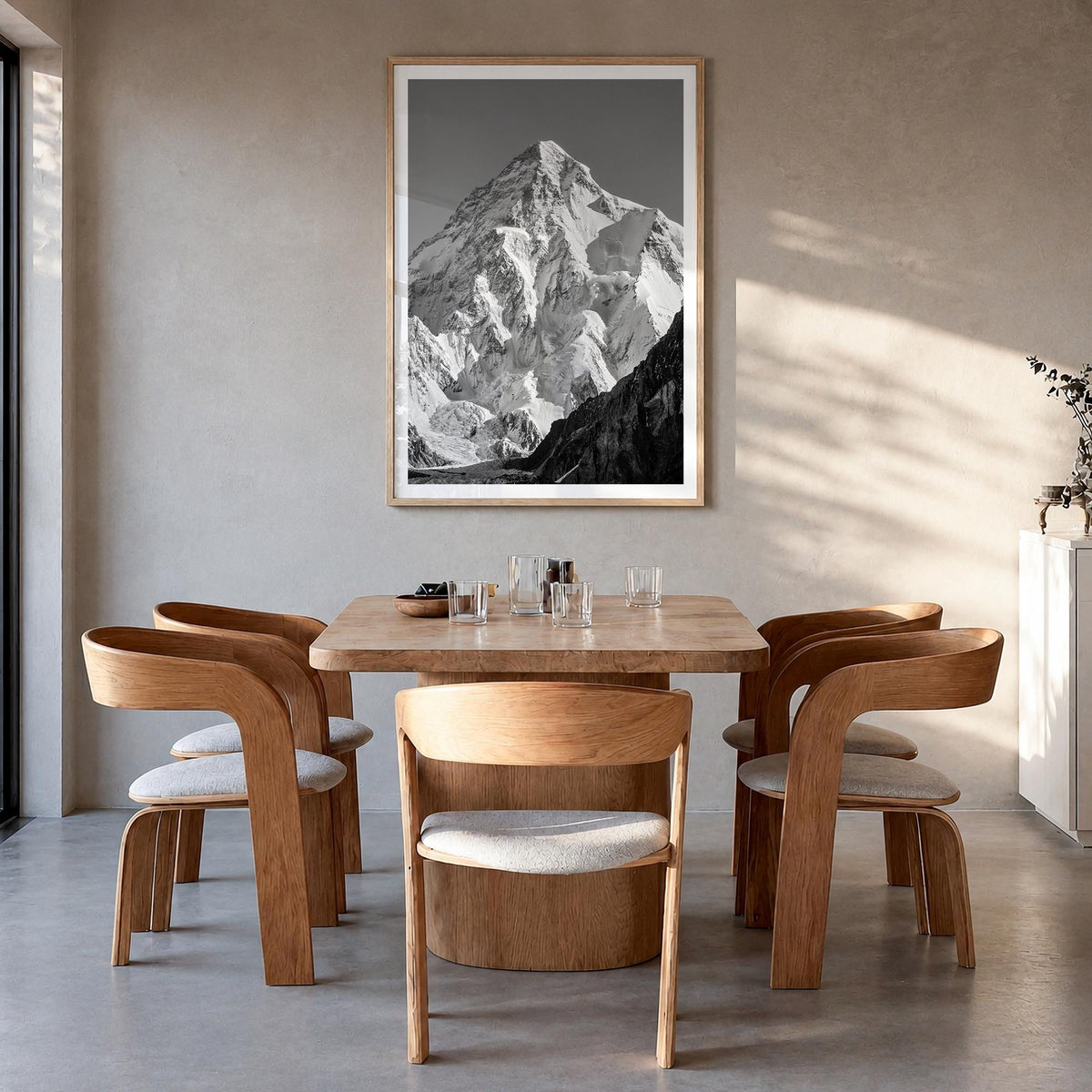 K2 black & white photo poster of Pakistan & China – vertical wall art in natural wood frame with white border, hanging on wal
