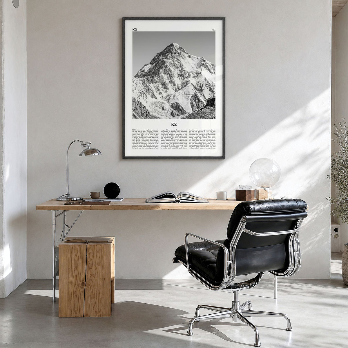 K2 Newspaper Poster in a black wood frame, hanging in a bright home office