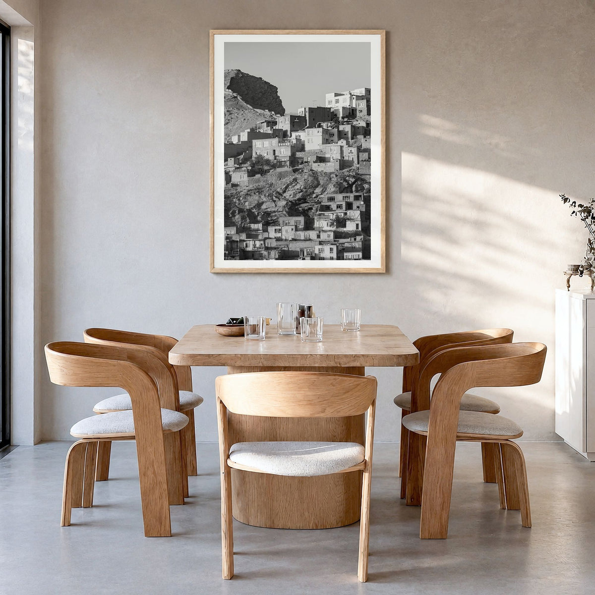 Kabul Photo Poster in a natural wood frame, hanging in a dining room, white border