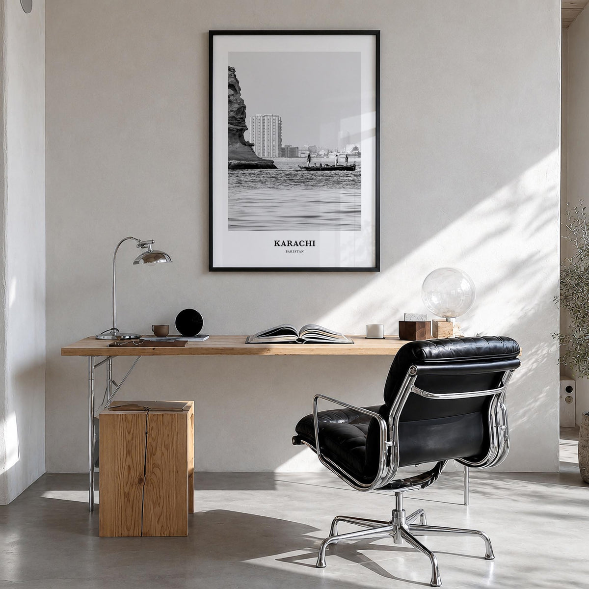 Karachi black & white classic poster of Pakistan – vertical wall art in black wood frame, hanging on wall