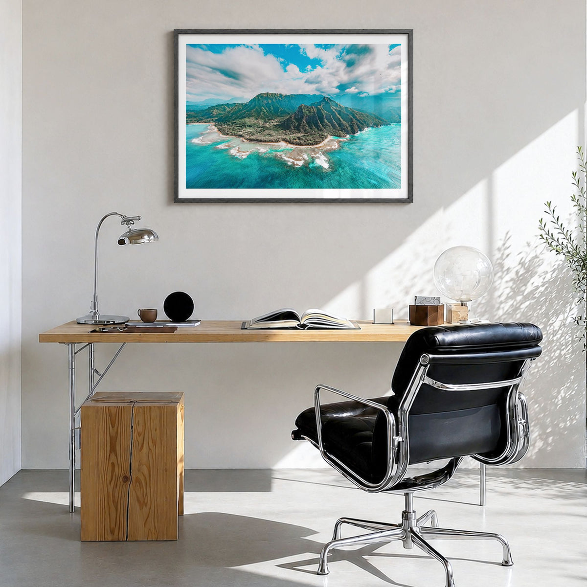 Kauai Photo Poster in a black wood frame, hanging in a bright home office, white border