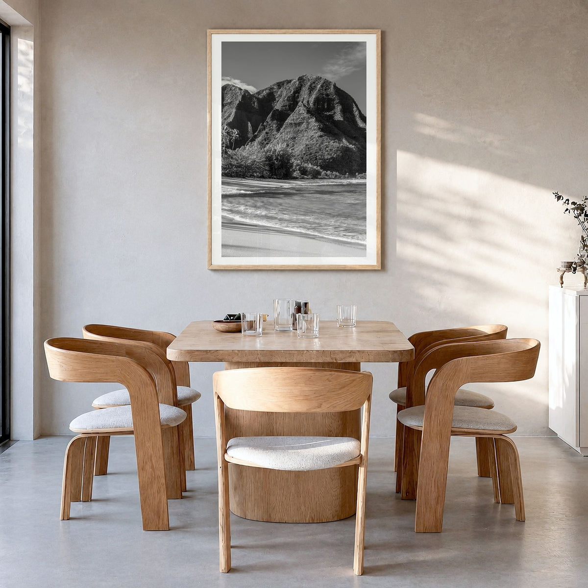 Kauai Photo Poster in a natural wood frame, hanging in a dining room, white border