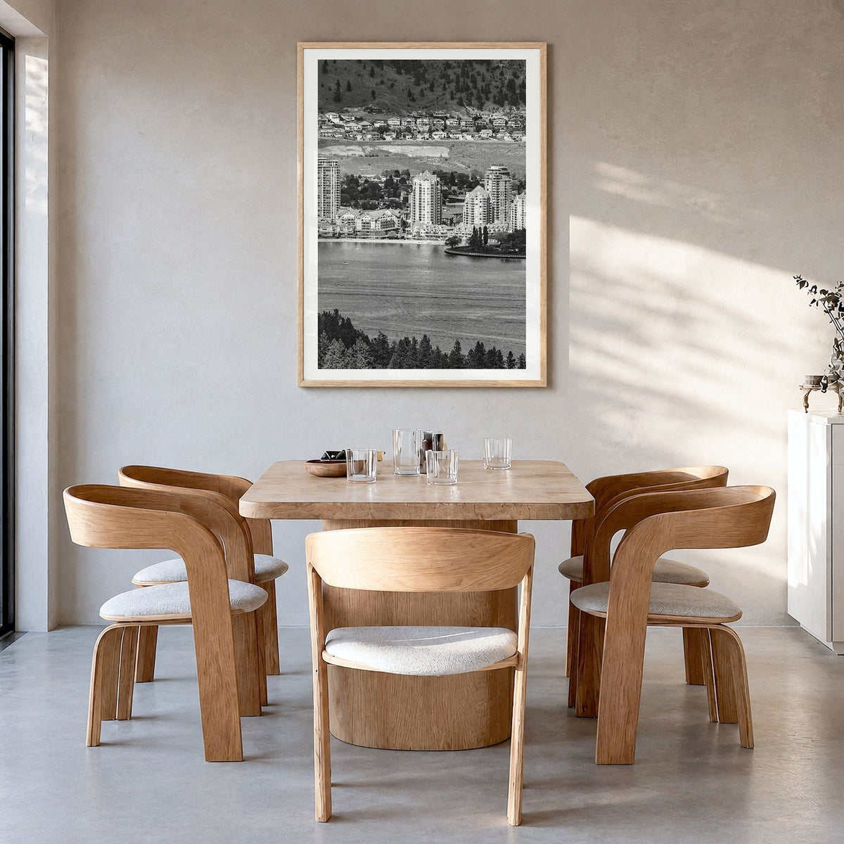 Kelowna Photo Poster in a natural wood frame, hanging in a dining room, white border