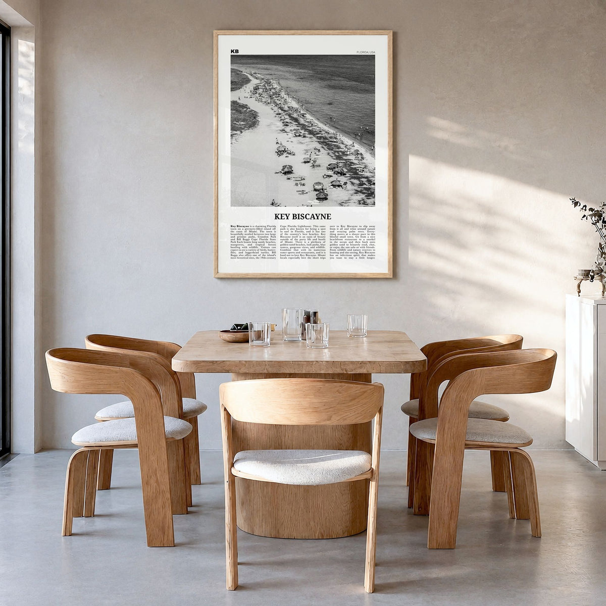 Key Biscayne Newspaper Poster in a natural wood frame, hanging in a dining room