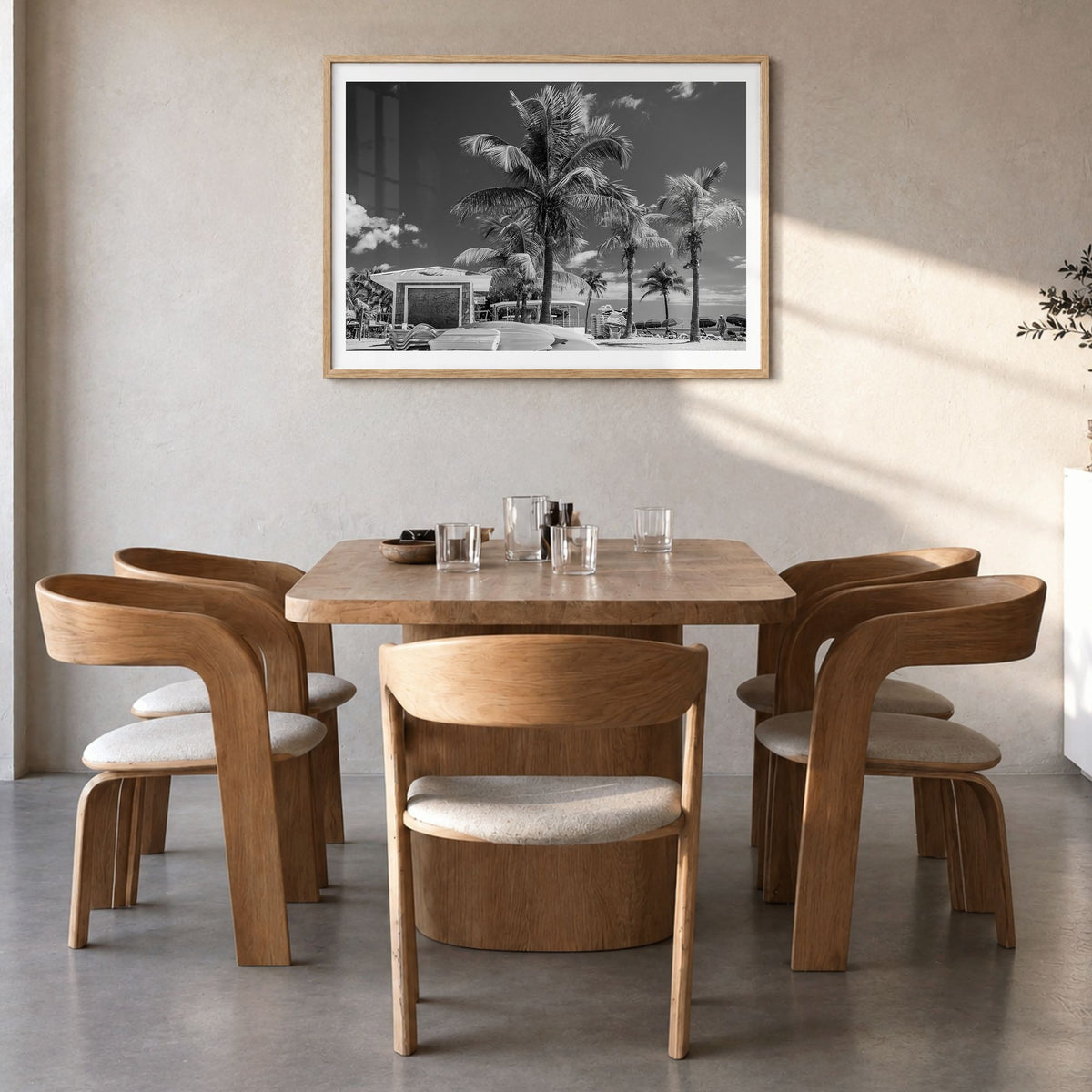 Key West Photo Poster in a natural wood frame, hanging in a dining room, white border