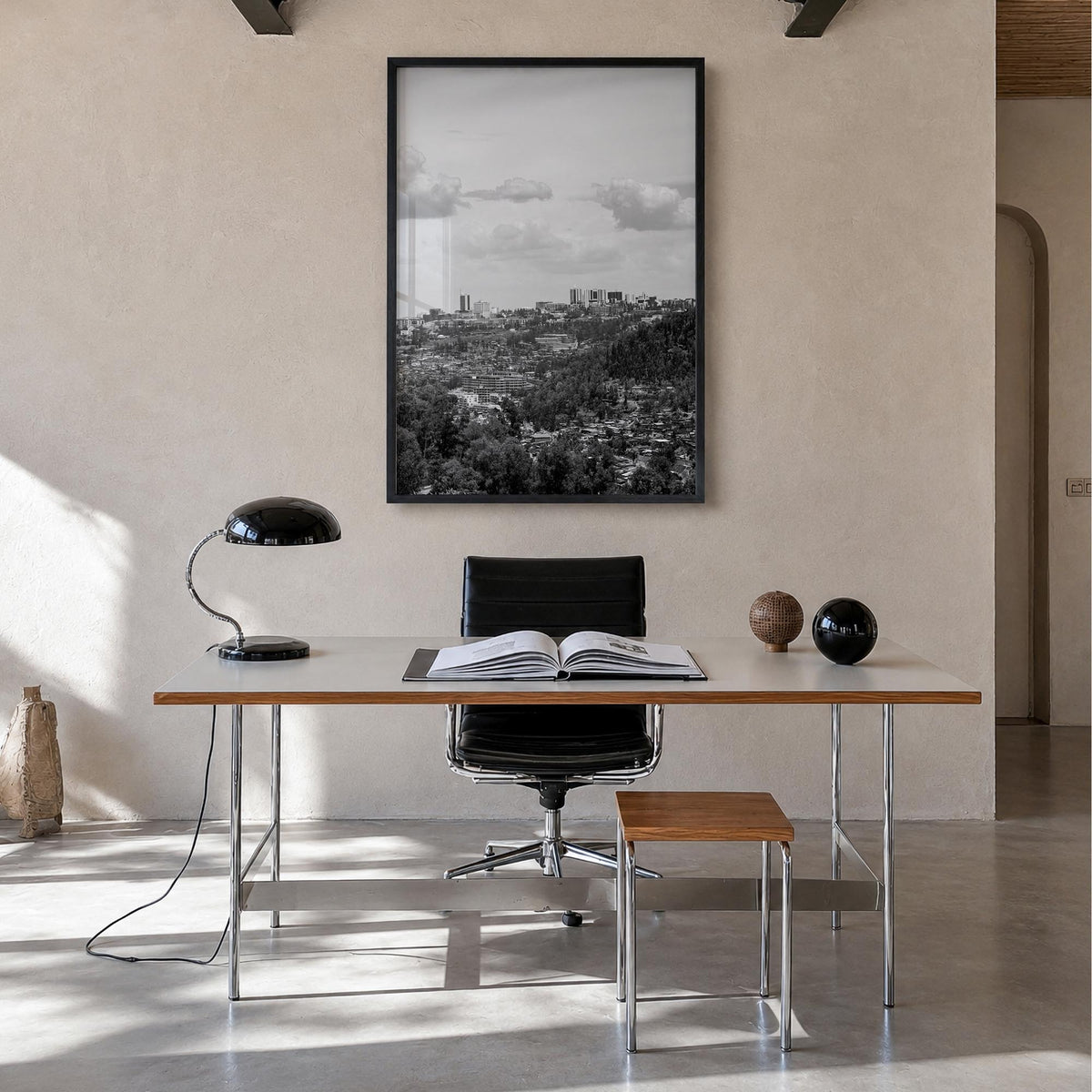 Kigali black & white photo poster of Rwanda – vertical wall art in black wood frame, hanging on wall