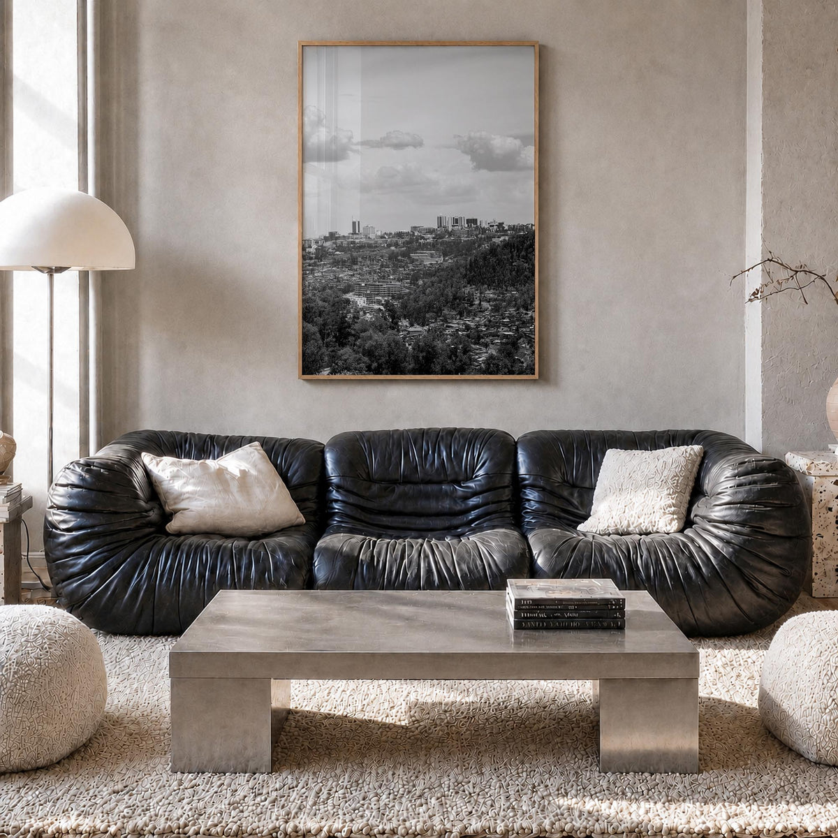 Kigali black & white photo poster of Rwanda – vertical wall art in natural wood frame, hanging on wall