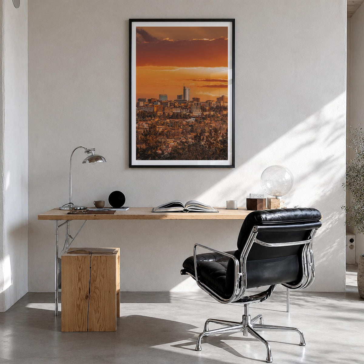 Kigali colorful photo poster of Rwanda – vertical wall art in black wood frame with white border, hanging on wall