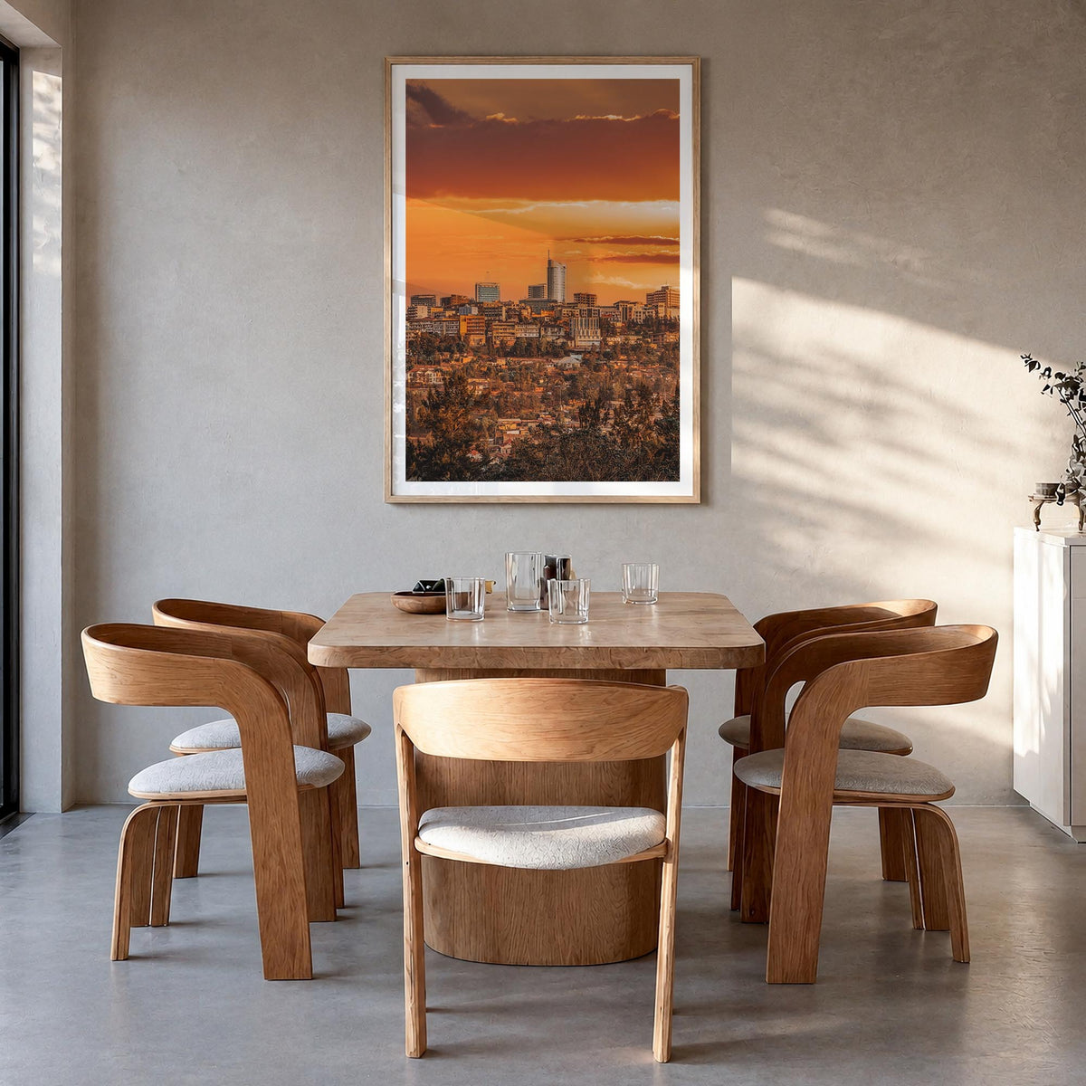 Kigali colorful photo poster of Rwanda – vertical wall art in natural wood frame with white border, hanging on wall