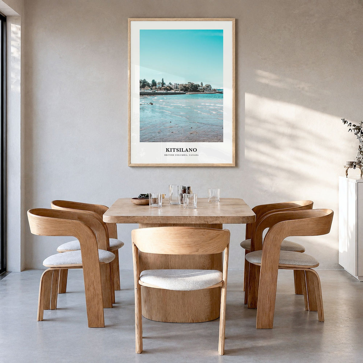 Kitsilano Classic Poster in a natural wood frame, hanging in a dining room