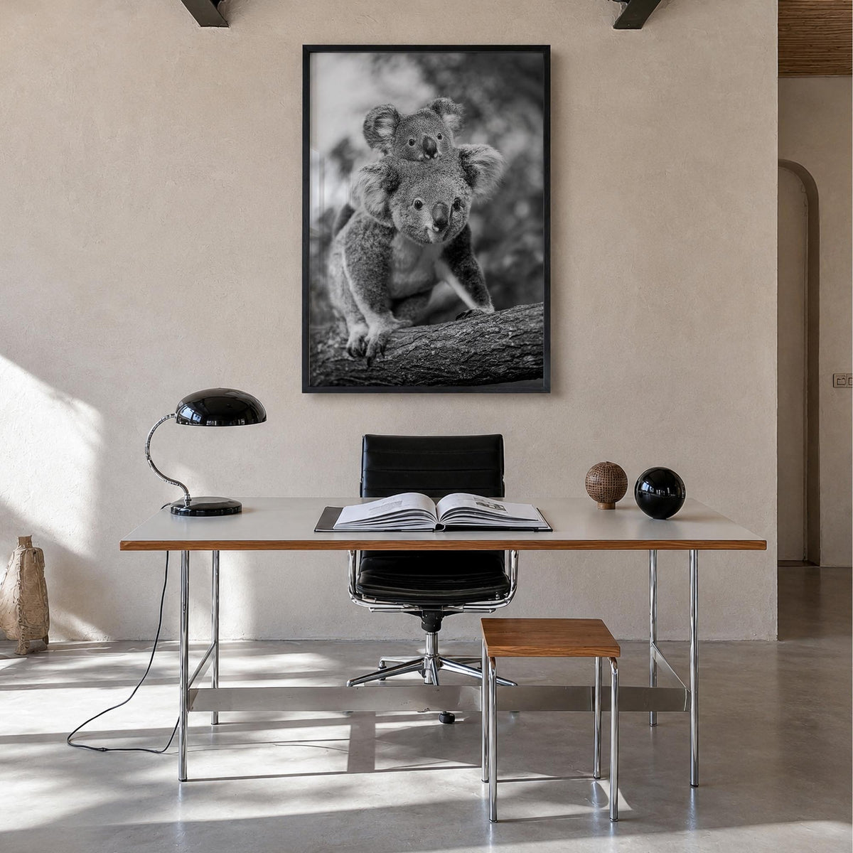 Koala no. 2 black & white photo poster – vertical wall art in black wood frame, hanging on wall