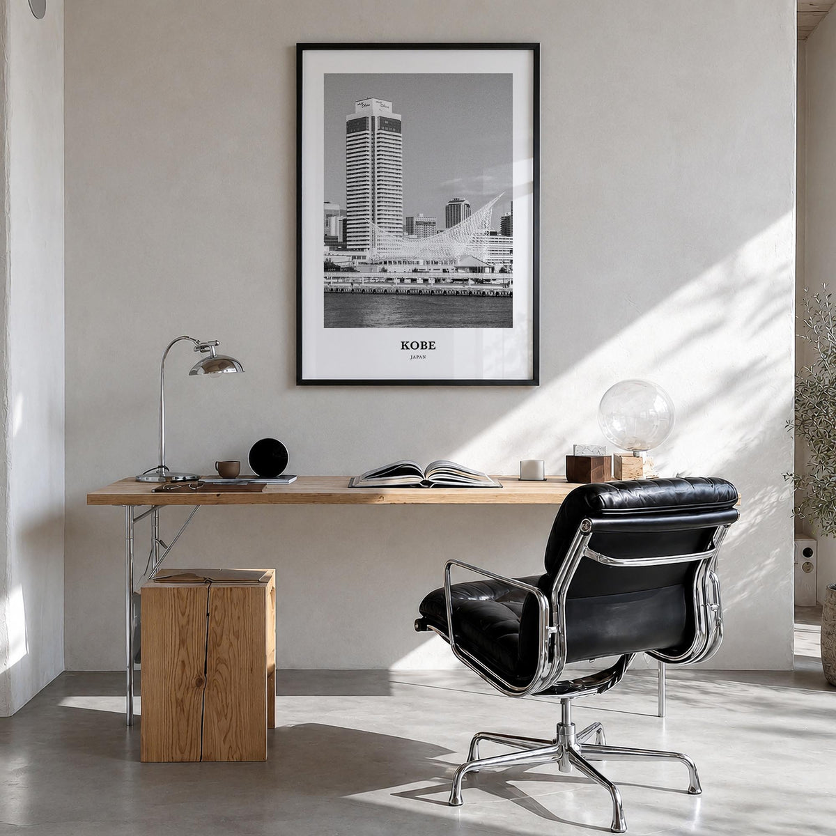 Kobe black & white classic poster of Japan – vertical wall art in black wood frame, hanging on wall