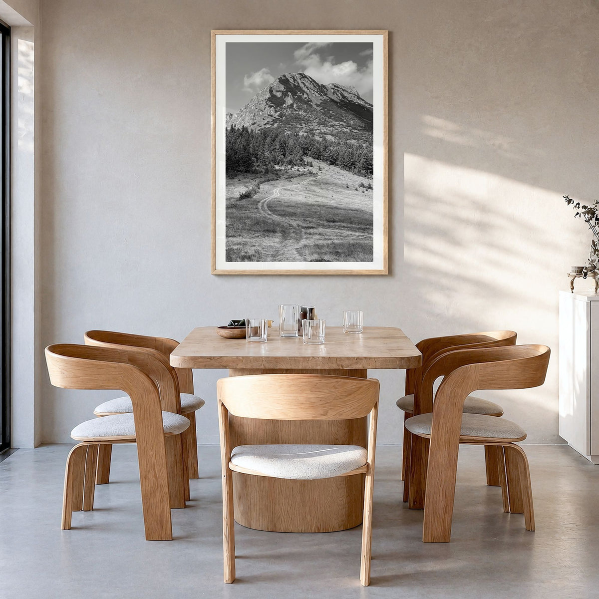 Kosovo Photo Poster in a natural wood frame, hanging in a dining room, white border